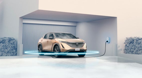 Nissan ARIYA charging at home with a blue ring circling the vehicle | Chico Nissan in Chico CA